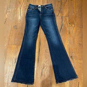 Kan Can dark wash denim.